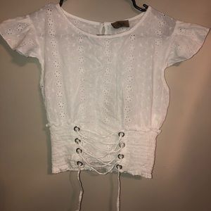 White cropped and corseted blouse with accents